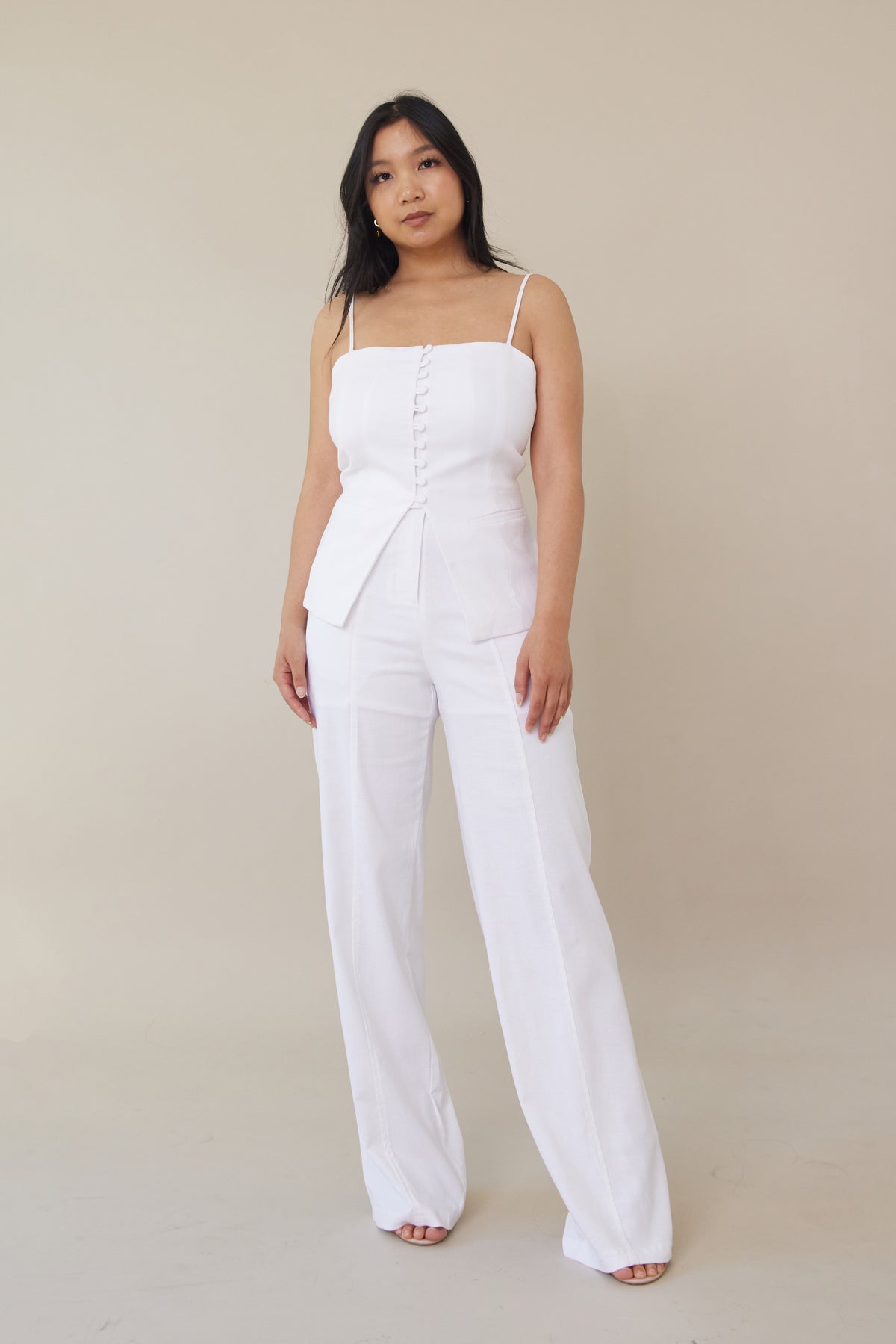 white high waist linen cotton trousers button front zipper closure with three buttons relaxed straight leg cut fit