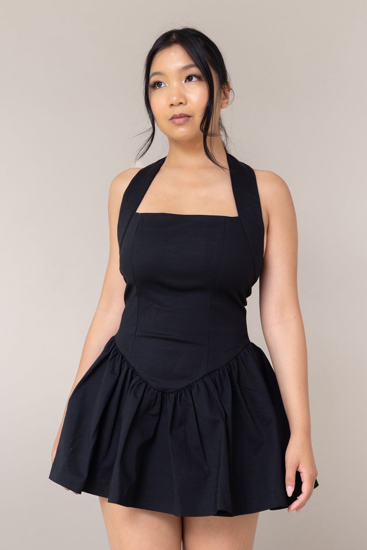 black halter corset fitted mini sexy dress flutter low waist flare out skirt pockets straight neckline sleeveless backless
