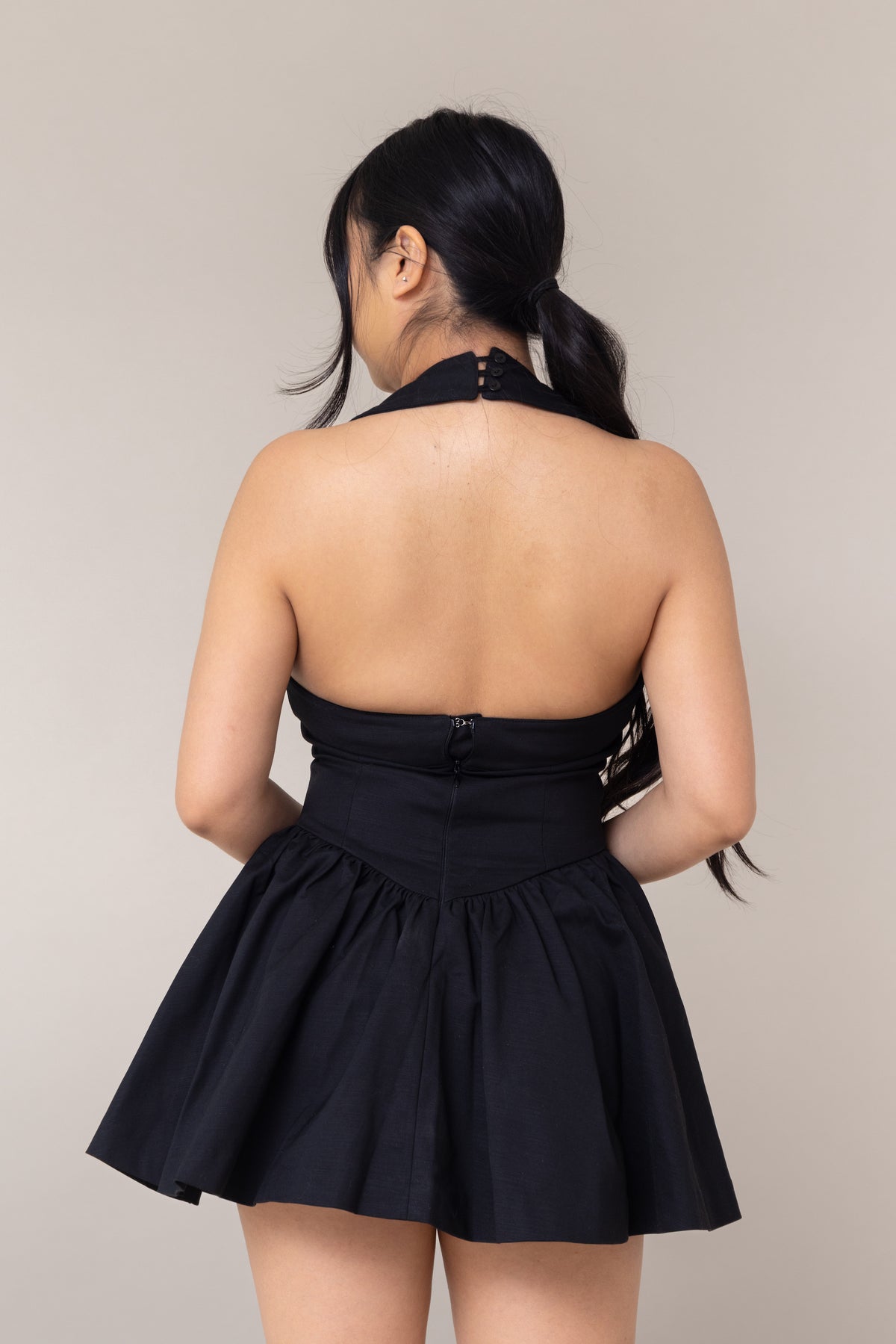 black halter corset fitted mini sexy dress flutter low waist flare out skirt pockets straight neckline sleeveless backless