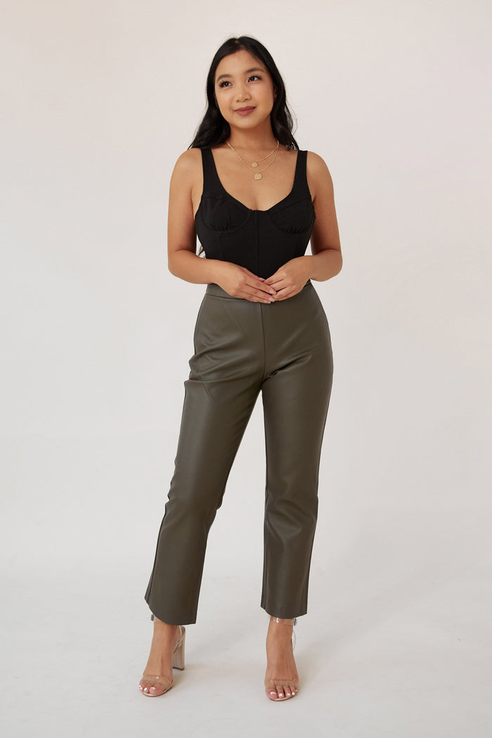vegan leather pants high rise flare silhouette front slit detail women's fashion trendy stylish bottoms casual chic wear modern wardrobe essential