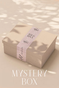 wild rina mystery box women's clothing accessories fashion surprise curated outfits wardrobe refresh trendy styles boho chic modern casual wear contemporary pieces gift idea unique clothing