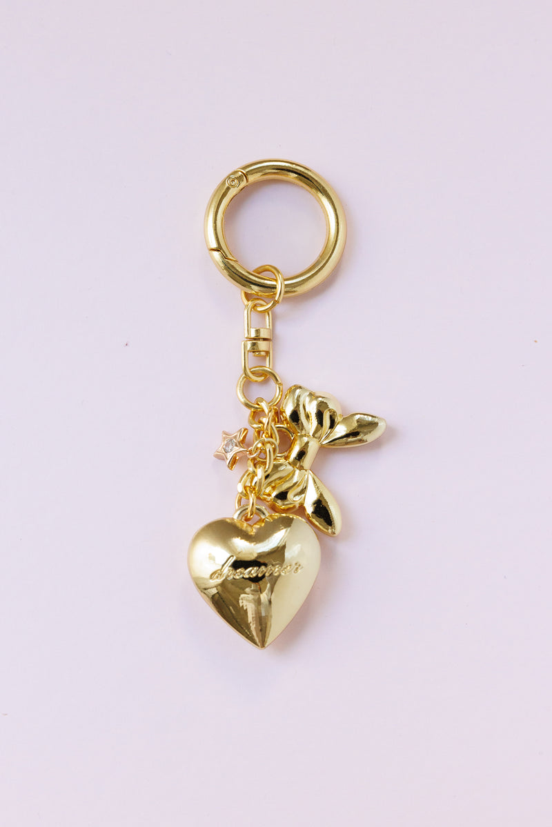 gold dainty heart bag charm engraved dreamer script gold bow star detail key ring accessory for handbags stylish fashion bag charm