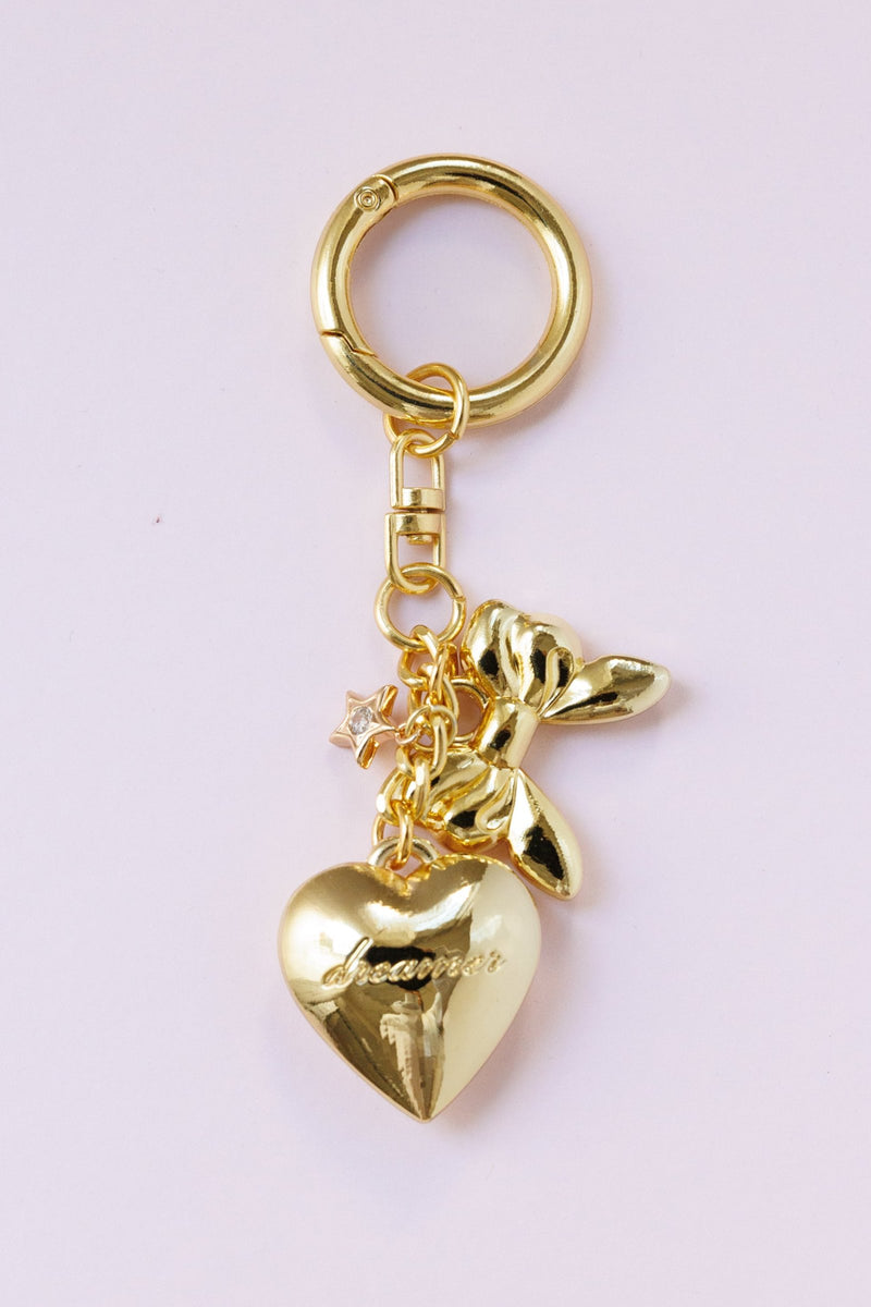 gold dainty heart bag charm engraved dreamer script gold bow star detail key ring accessory for handbags stylish fashion bag charm