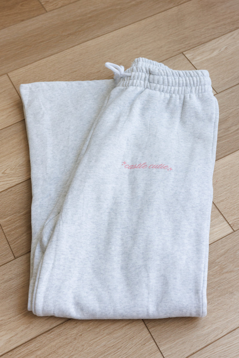 gray fleece lined sweatpants with adjustable drawstring hem straight leg loose oversized fit pink castle cutie design with sparkles perfect for casual cozy wear