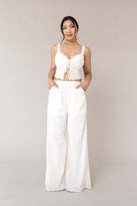 cream two piece outfit coordinated matching set linen corset style adjustable tie front closure sleeveless high waist ruffled lace flare loose pants functional pockets smocked back