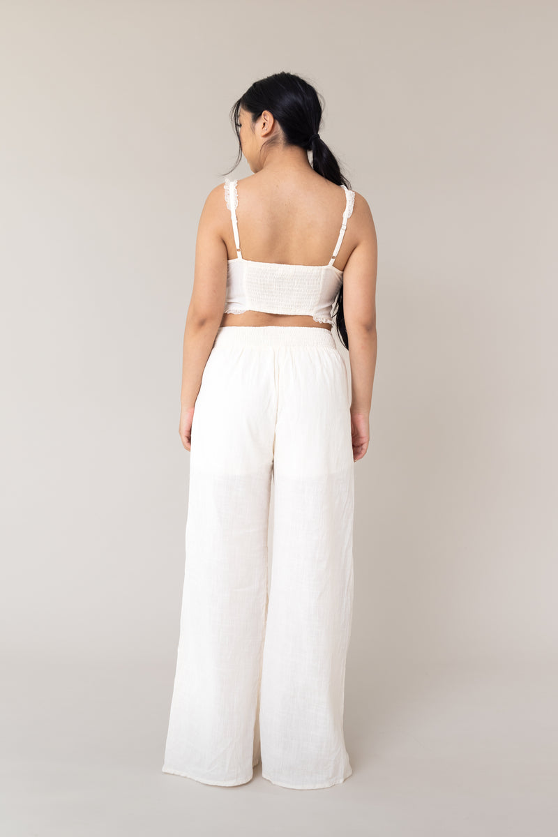 cream two piece outfit coordinated matching set linen corset style adjustable tie front closure sleeveless high waist ruffled lace flare loose pants functional pockets smocked back