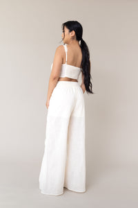 cream two piece outfit coordinated matching set linen corset style adjustable tie front closure sleeveless high waist ruffled lace flare loose pants functional pockets smocked back