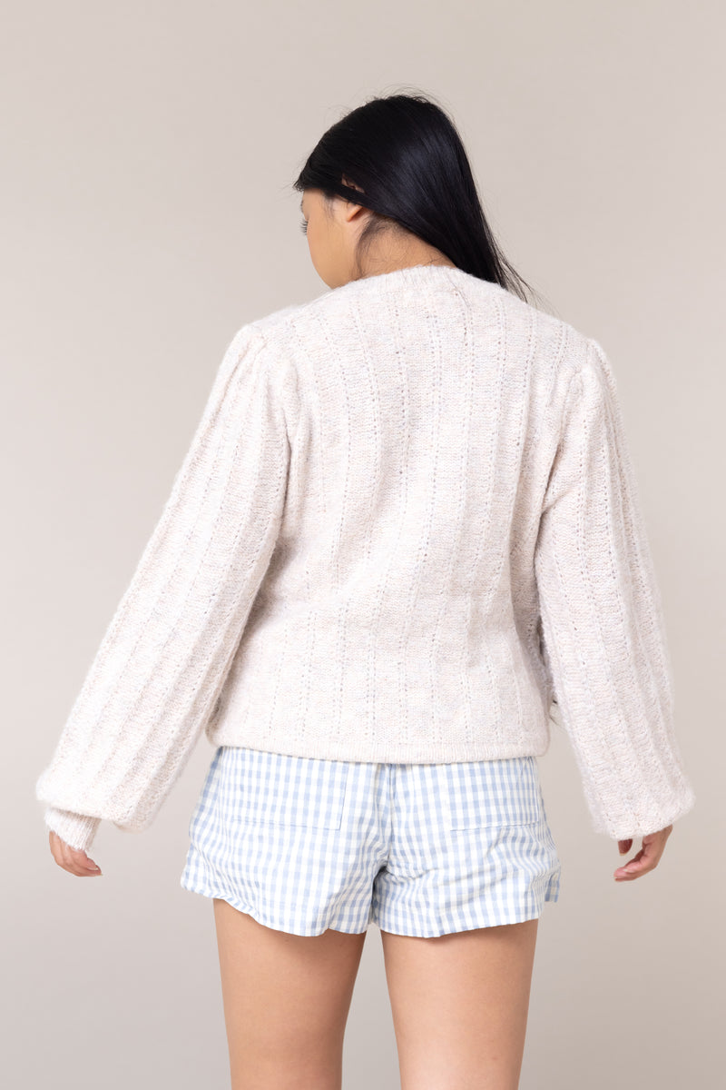 beige knit cardigan puff long sleeve button front closure cuffs round neck ribbed scallop edging