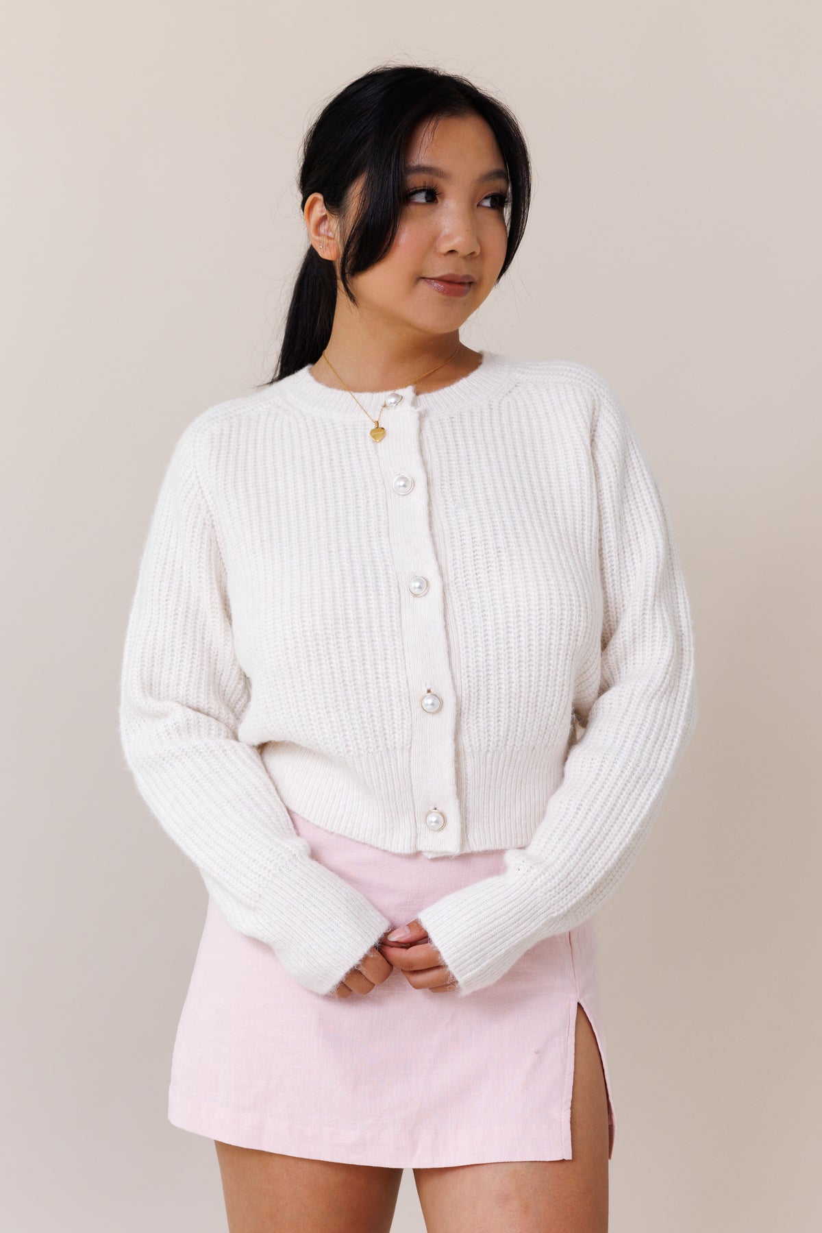 white knit cardigan ribbed cuffed hems  stretchy fit crew neck pearl button front closure long sleeve