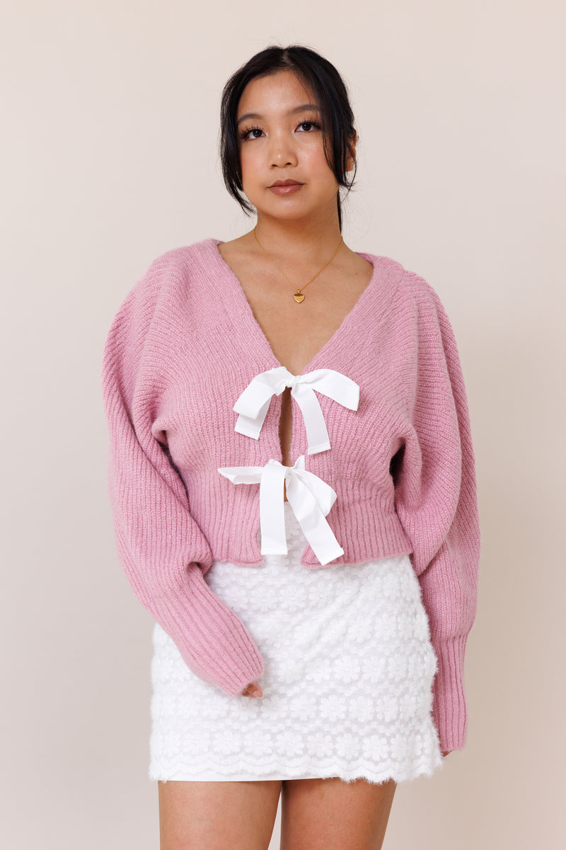 pink knit cardigan sweater dolman long sleeve cuff white ribbon bow tie closure stretchy v neckline