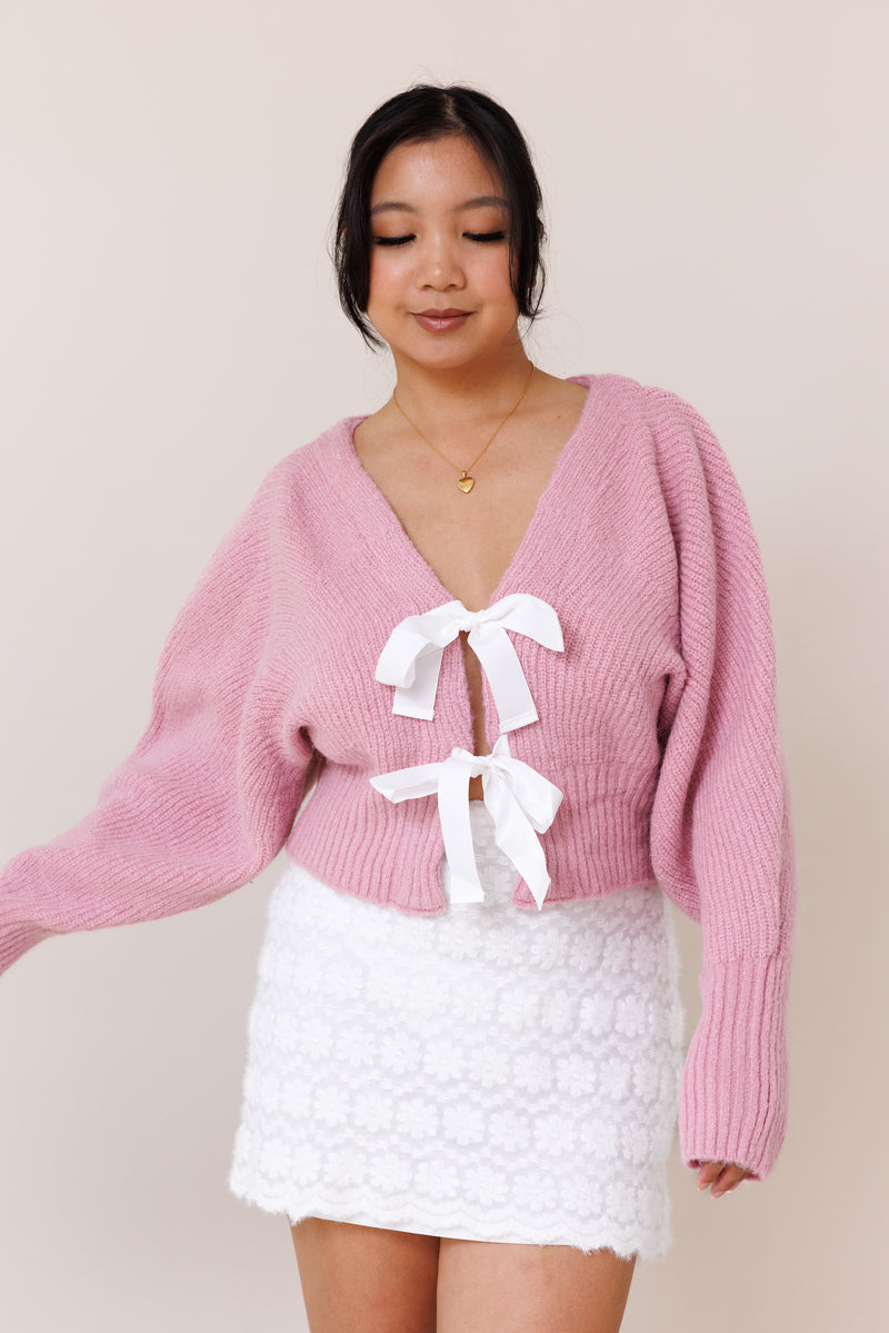 pink knit cardigan sweater dolman long sleeve cuff white ribbon bow tie closure stretchy v neckline