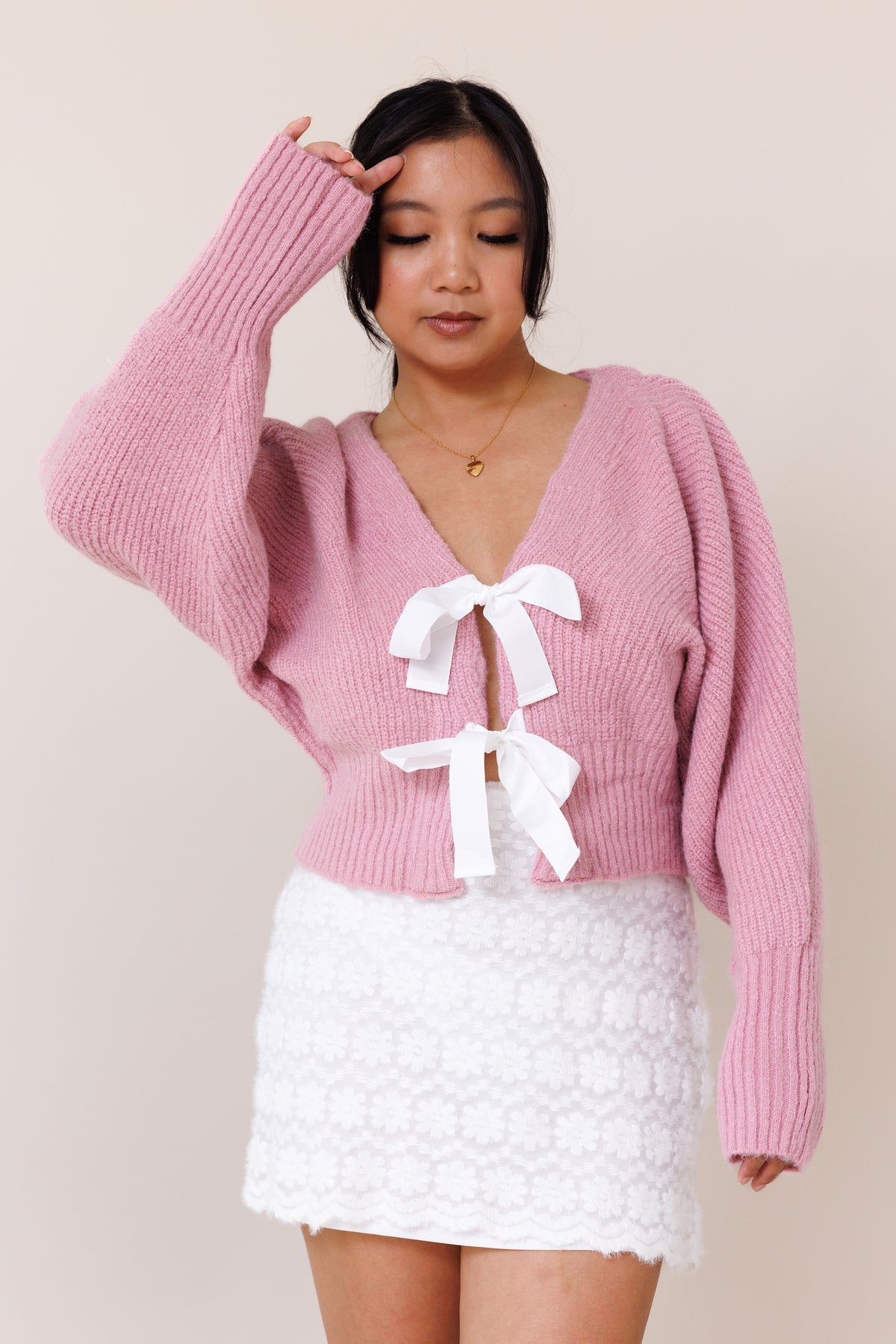 pink knit cardigan sweater dolman long sleeve cuff white ribbon bow tie closure stretchy v neckline