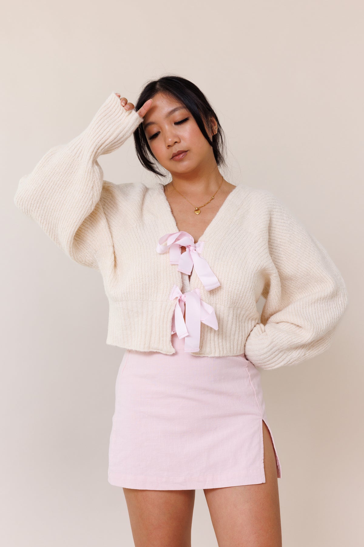 cream knit cardigan sweater dolman long sleeve cuff pink ribbon bow tie closure stretchy v neckline