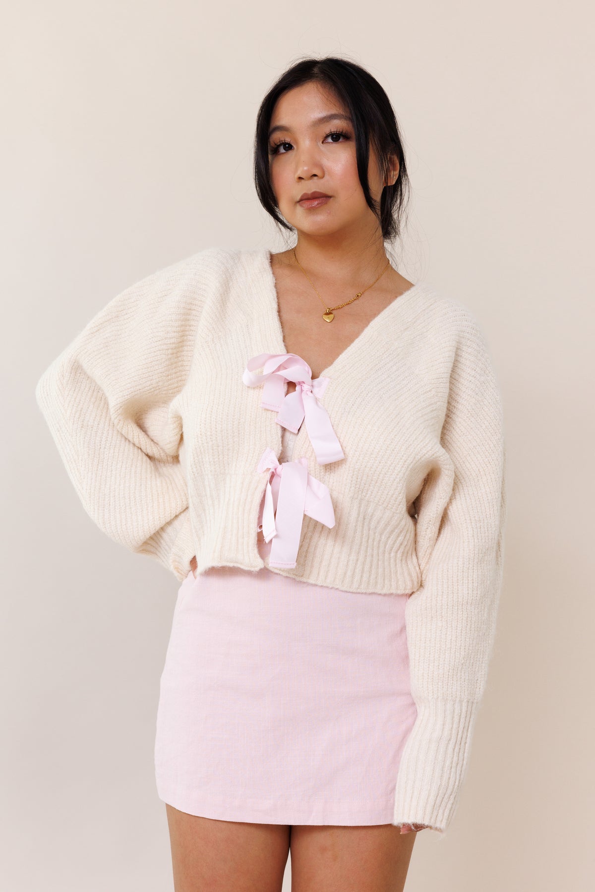 cream knit cardigan sweater dolman long sleeve cuff pink ribbon bow tie closure stretchy v neckline