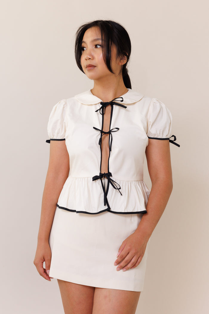 cream blouse open front black ribbon bow tie puff short sleeves round collar flutter