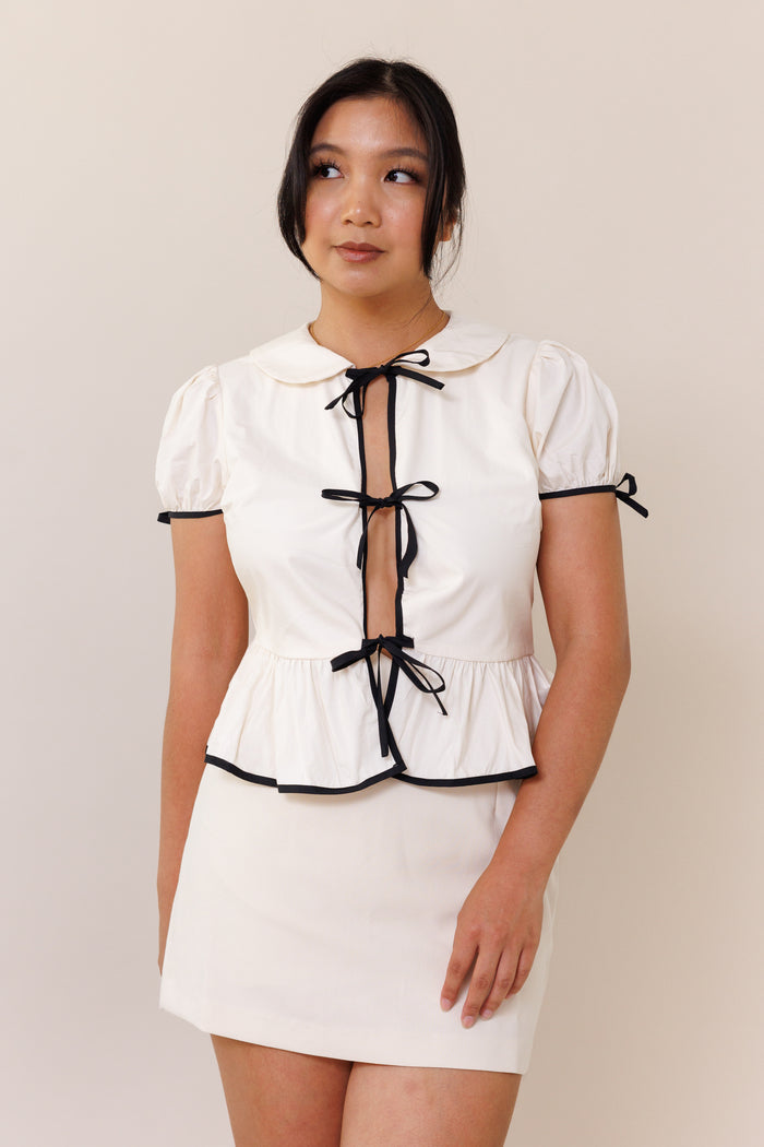 cream blouse open front black ribbon bow tie puff short sleeves round collar flutter